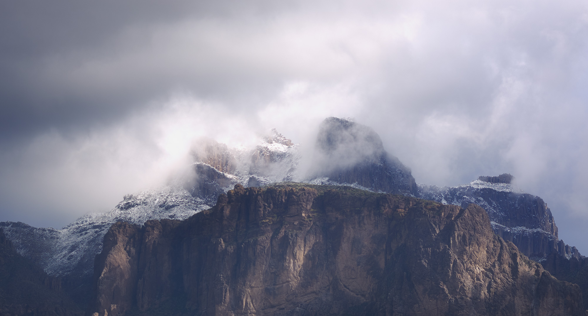 Landscape photo of Superstition Mountain in Arizona covered in snow, arizona landscape photography