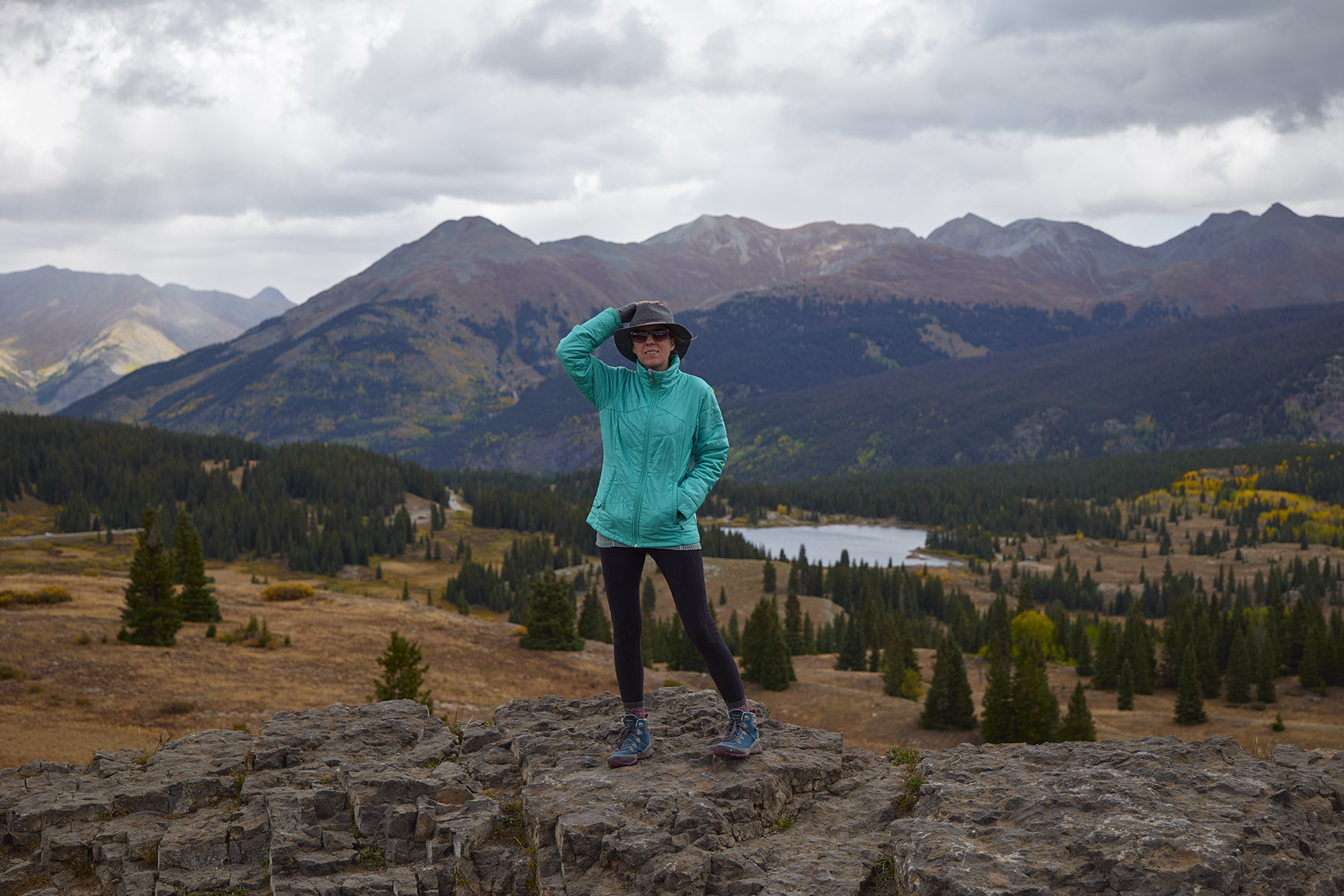 Female hiker standing on a rock in the mountains, Colorado Landscape Photography